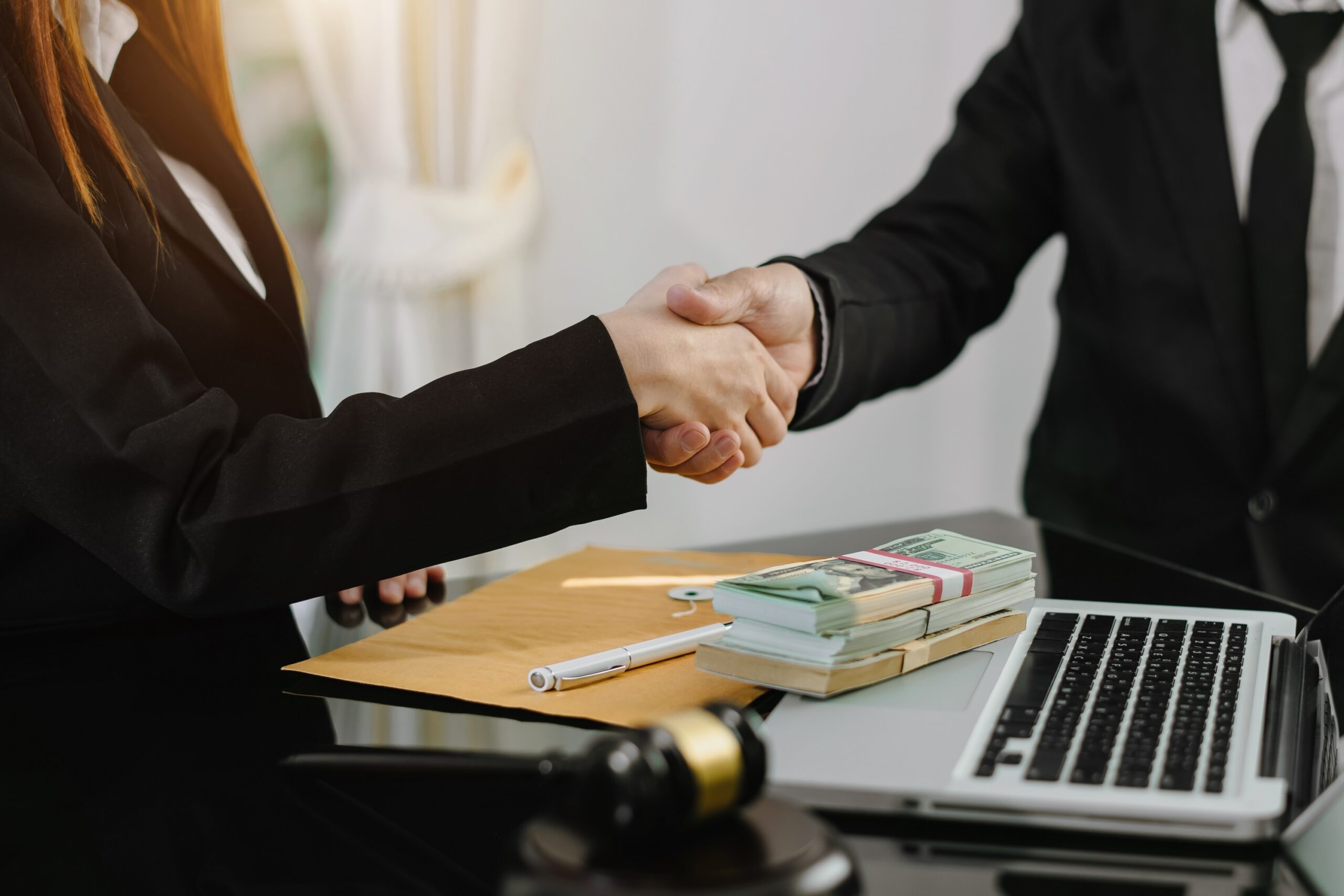 Judge and client shaking hands and lawyers discussing contract papers  after adviced in background at courtroom, lawyer service concept at office